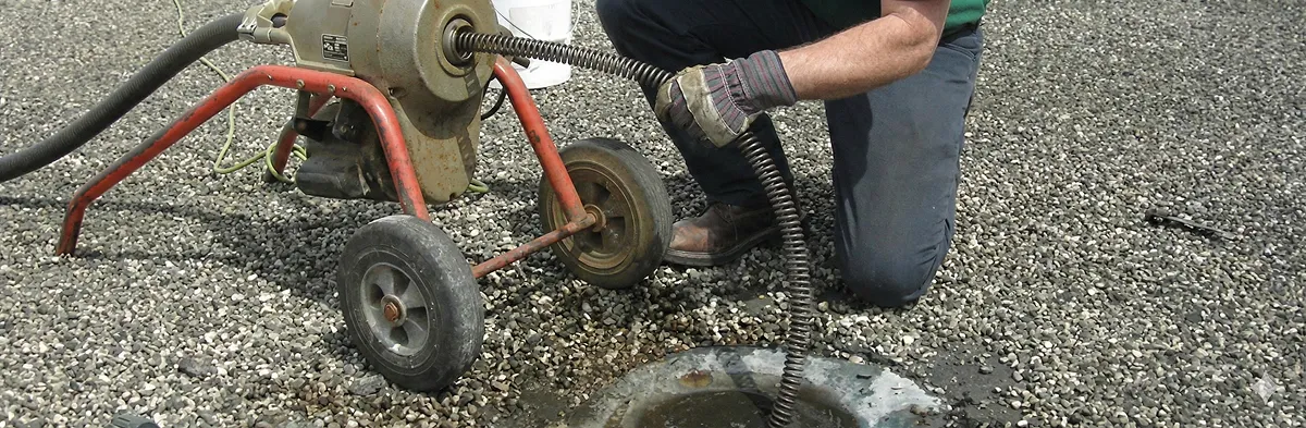 sewer rodding technician actively removing blockages from a sewer line in Pasadena, CA